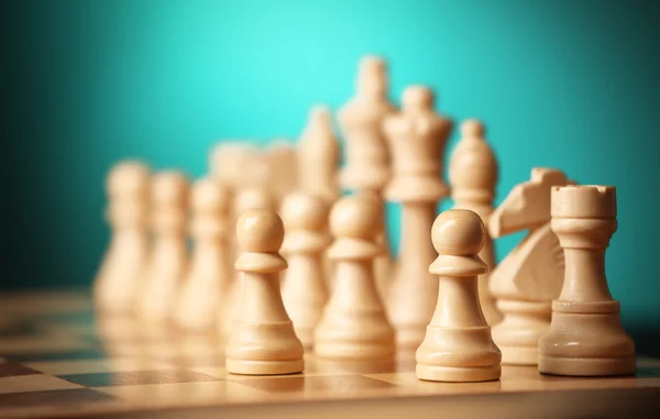 Chess pieces and game board — Stock Photo, Image