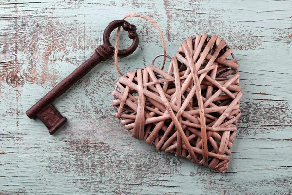 Old key with decorative heart — Stock Photo, Image