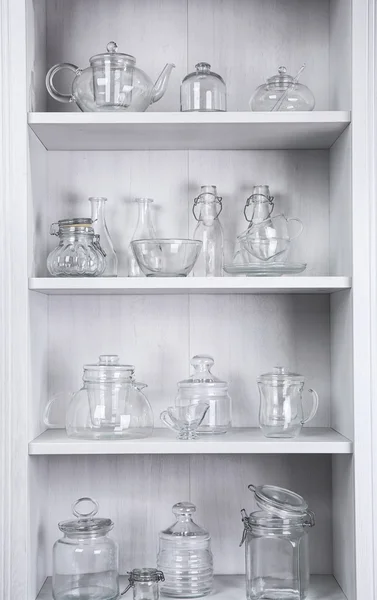 Glass dishes on shelves
