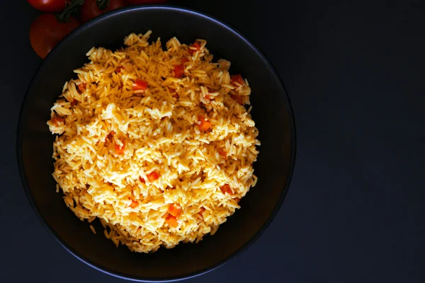 Stewed rice with a carrot on a plate — Stock Photo, Image