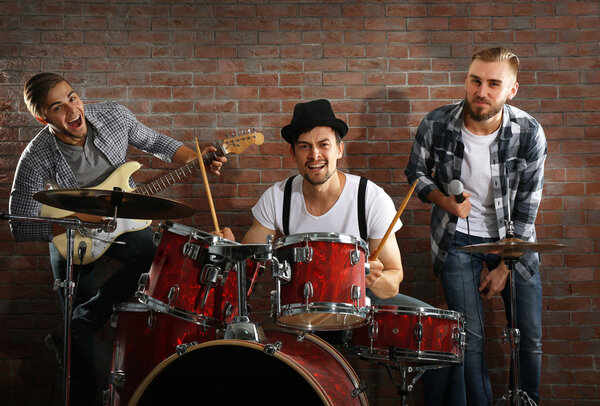 Musicians playing drums and guitar