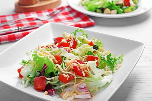 Tasty salmon salad on wooden table background — Stock Photo, Image