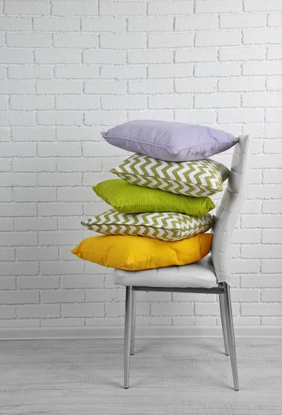 Colorful pillows on chair — Stock Photo, Image