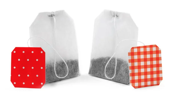 Unused teabags with red labels — Stock Photo, Image