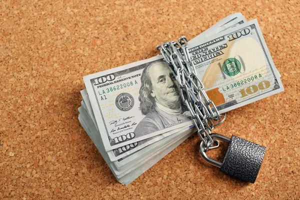 Dollars currency with lock and chain — Stock Photo, Image