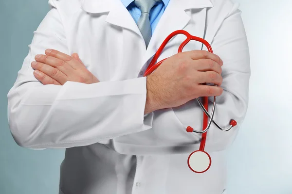 Doctor with stethoscope at workplace — Stock Photo, Image