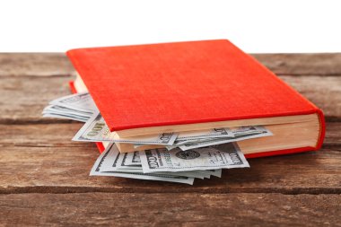İç içe geçmiş Doları banknot ile kırmızı kitap 