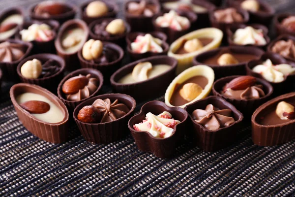 Chocolate sweets on fabric background — Stock Photo, Image