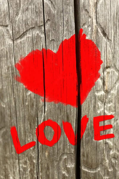 Word "Love" painted on wall background — Stock Photo, Image