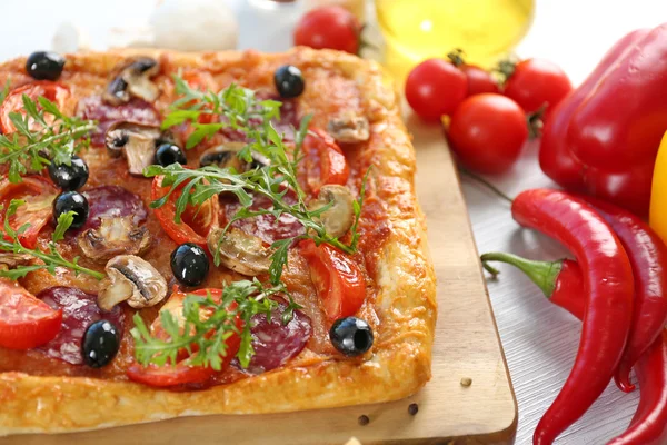 Rectangle delicious pizza on the table, close-up — Stock Photo, Image