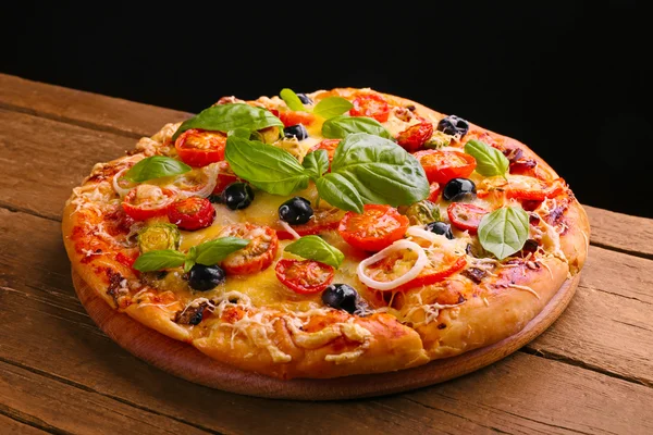 Delicious fresh pizza on black background — Stock Photo, Image