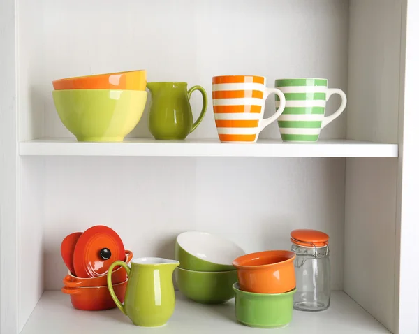 Tableware on shelves in the kitchen — Stock Photo, Image