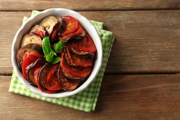 Ratatouille in bowl, on wooden table background — Stock Photo, Image