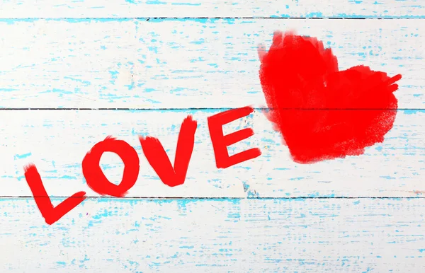 Word "Love" painted on wall background — Stock Photo, Image