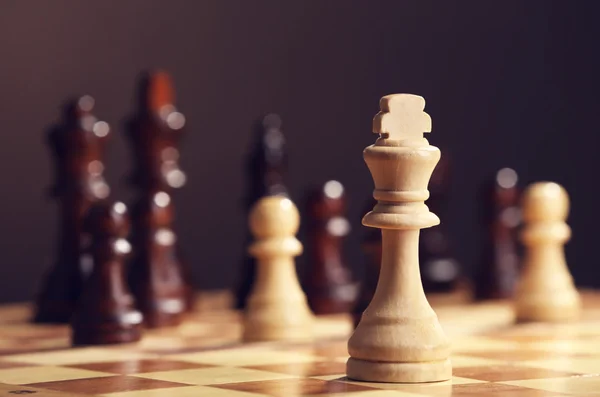 Chess pieces and game board — Stock Photo, Image