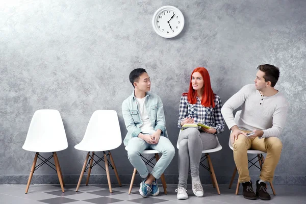 people sitting on chairs