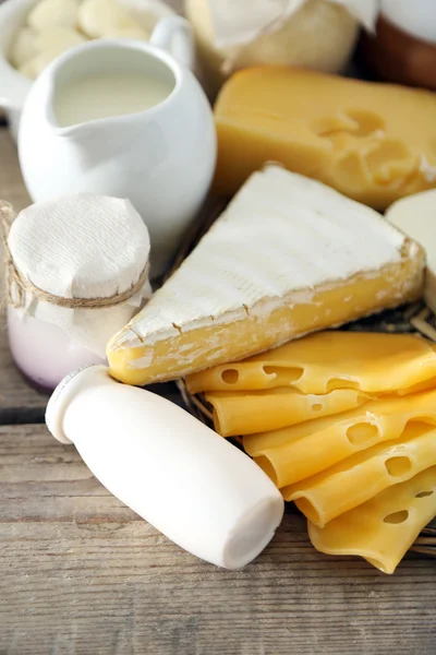 Set of fresh dairy products on old  wooden table, close up — Stock Photo, Image