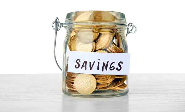 Jar for savings full of coins — Stock Photo, Image
