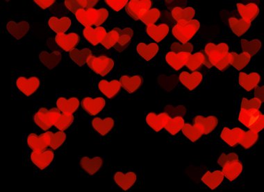 Siyah arkaplanda kırmızı kalpler