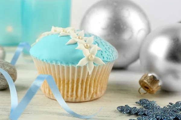Tasty blue cupcake with decorations, closeup — Stock Photo, Image