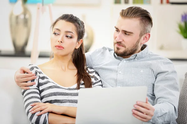 Happy couple and working on a laptop — Stock Photo, Image