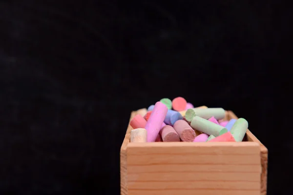 Wooden box of coloured chalk — Stock Photo, Image