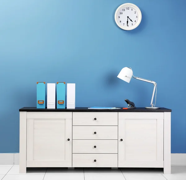 Wooden chest of drawers with folders — Stock Photo, Image