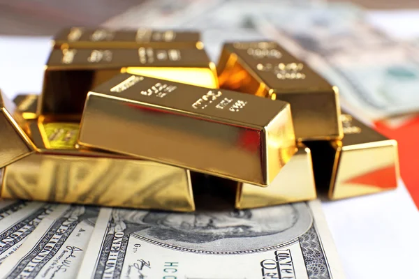 Gold bars with dollar banknotes — Stock Photo, Image