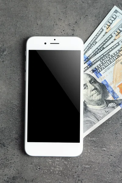 Mobile phone and money — Stock Photo, Image