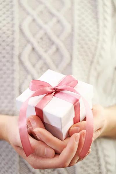 Hands holding beautiful small gift — Stock Photo, Image