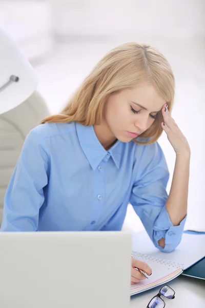 Tired woman at the laptop — Stock Photo, Image