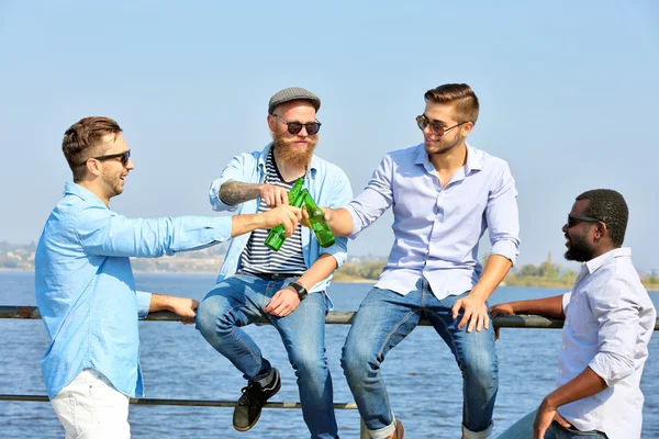 Men talking on the riverside — Stock Photo, Image