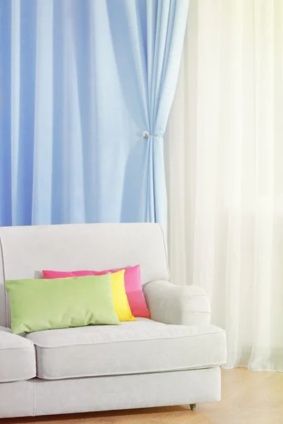 Sofa in room with curtains — Stock Photo, Image