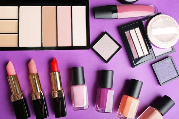 Cosmetics set on purple — Stock Photo, Image