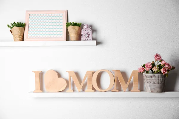 Inscription of wooden letters with heart and flowers — Stock Photo, Image