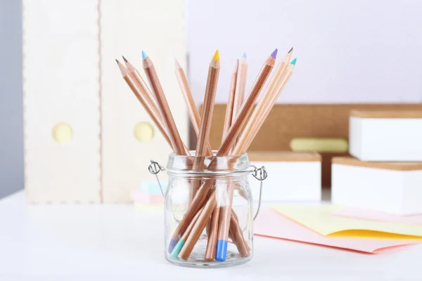 Coloured pencils in a glass pot — Stock Photo, Image