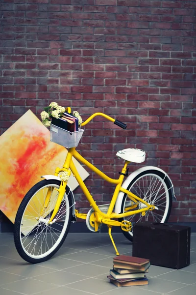 Yellow bicycle with books — Stock Photo, Image