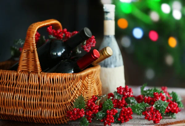 Wine in basket and Christmas tree — Stock Photo, Image