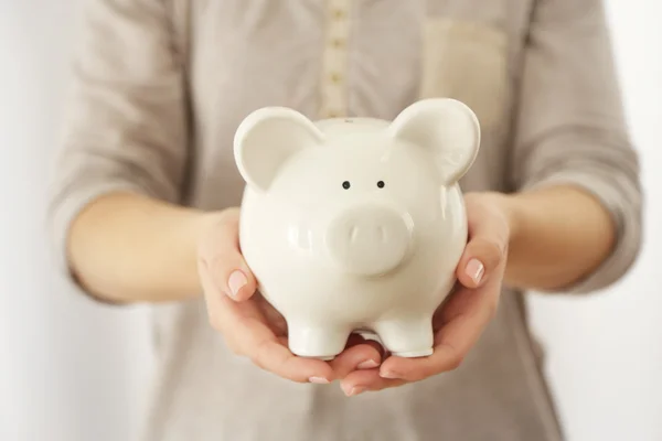 Hands holding piggy bank — Stock Photo, Image