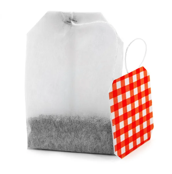 Чайная сумка с красной клетчатой этикеткой — стоковое фото