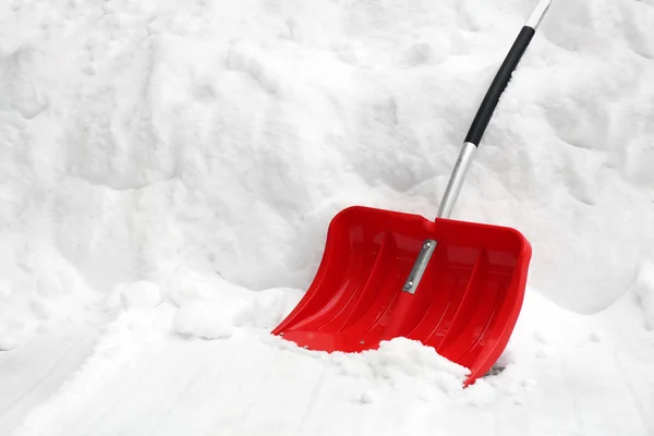 Red shovel for snow removal — Stock Photo, Image