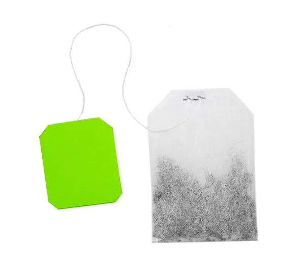 Teabag com rótulo verde isolado sobre fundo branco — Fotografia de Stock