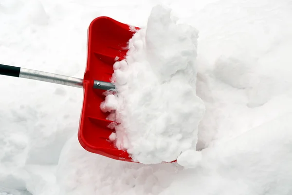 Red shovel for snow removal — Stock Photo, Image