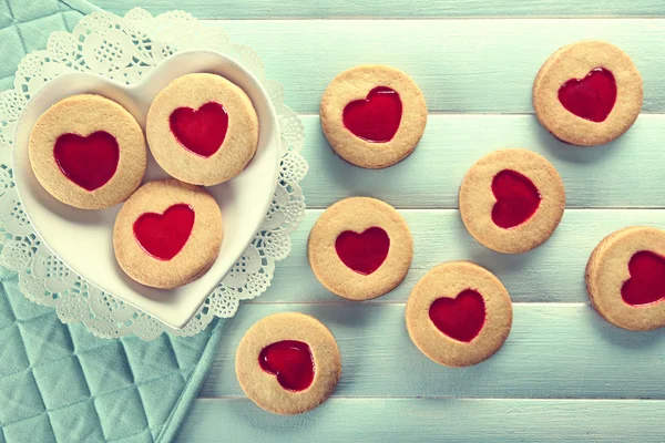 Assortment of love cookies on blue wooden table background — Stock Photo, Image