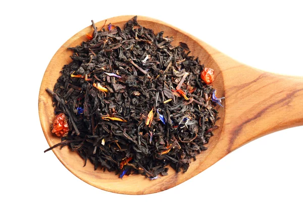 Trockener Tee mit Früchten in Holzlöffel, isoliert auf weißem — Stockfoto