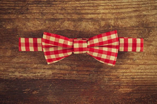 Bow tie on wooden table — Stock Photo, Image