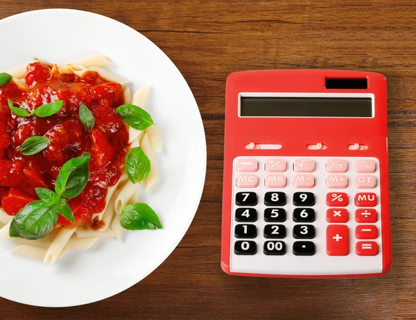 Miniräknare och läckra pasta — Stockfoto