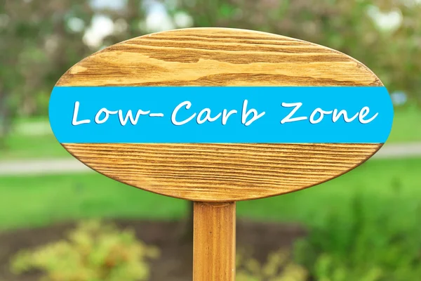 Low-Carb Zone text on wooden pointer on natural background — Stock Photo, Image