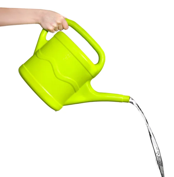 Female hand pouring water from green plastic watering can, isolated on white — Stock Photo, Image