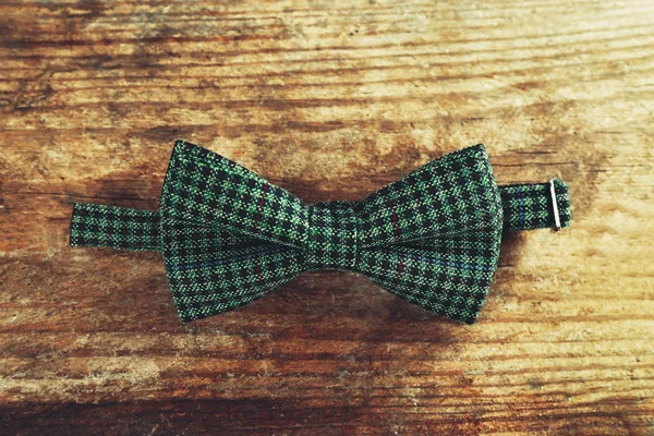 Bow tie on wooden table — Stock Photo, Image